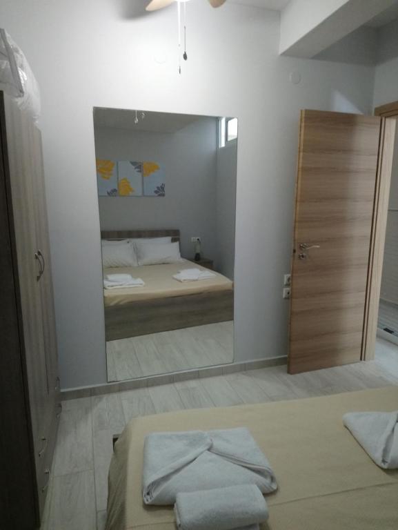 Postel nebo postele na pokoji v ubytování JK's GUESTHOUSE KARDAMAINA