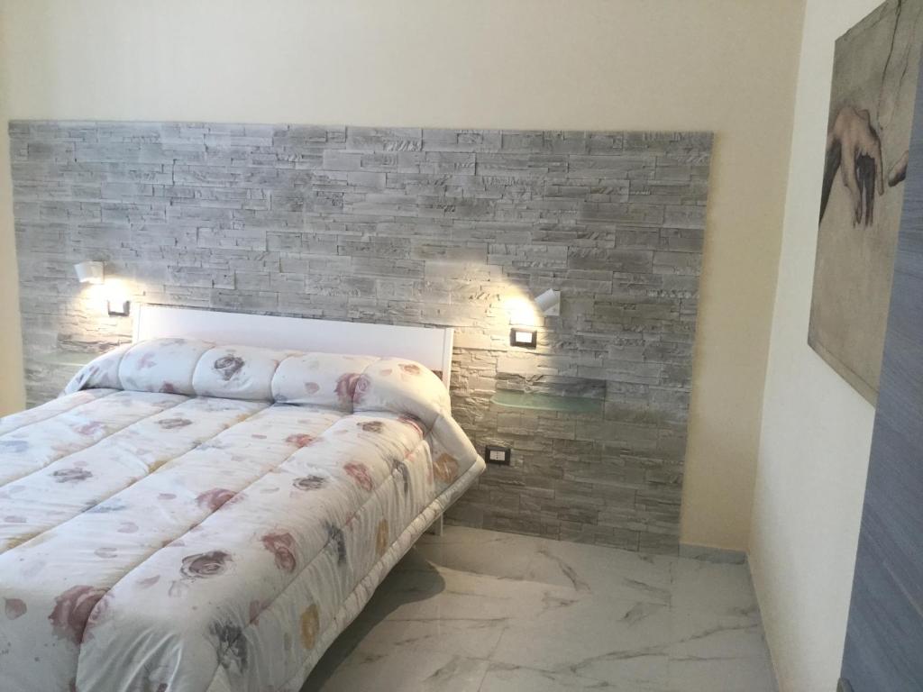 Un pat sau paturi într-o cameră la Carmine's holiday home