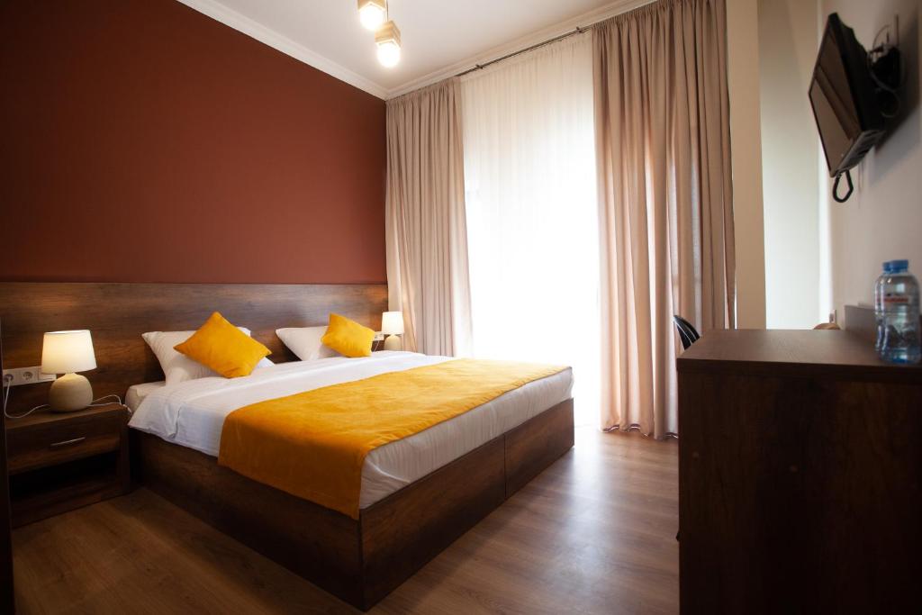 Postel nebo postele na pokoji v ubytování Hotel Avenue 106