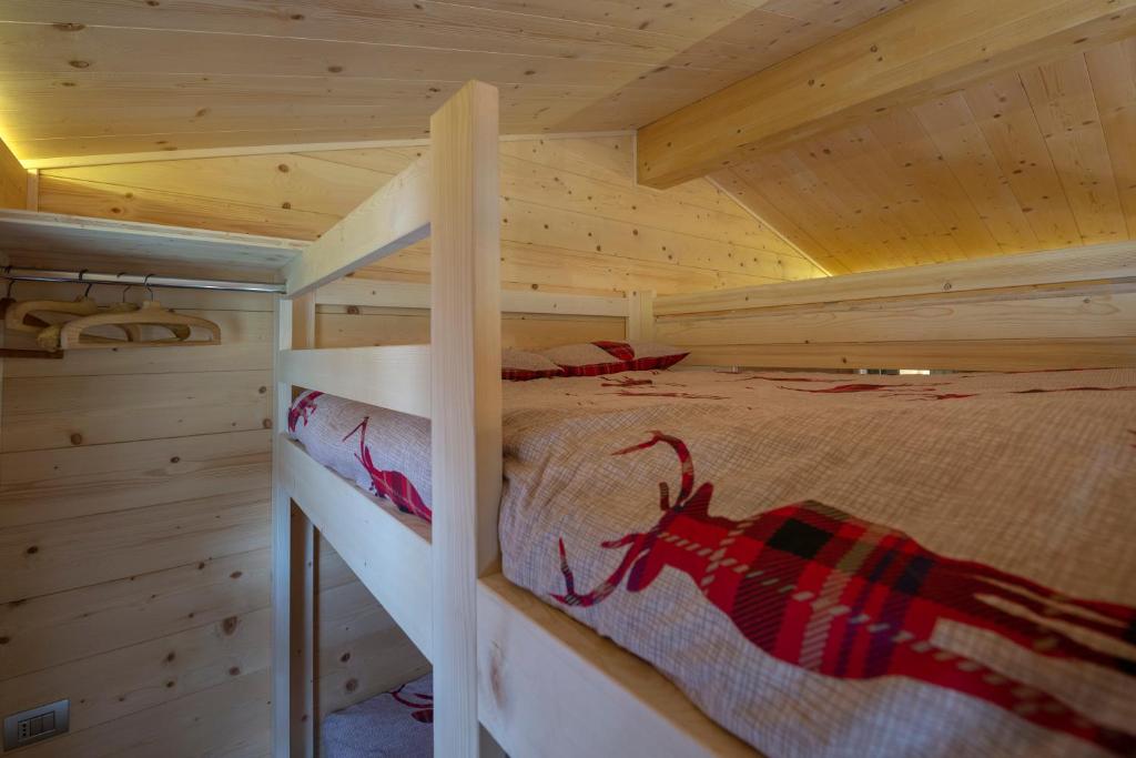 Posteľ alebo postele v izbe v ubytovaní Mini Chalet Walser