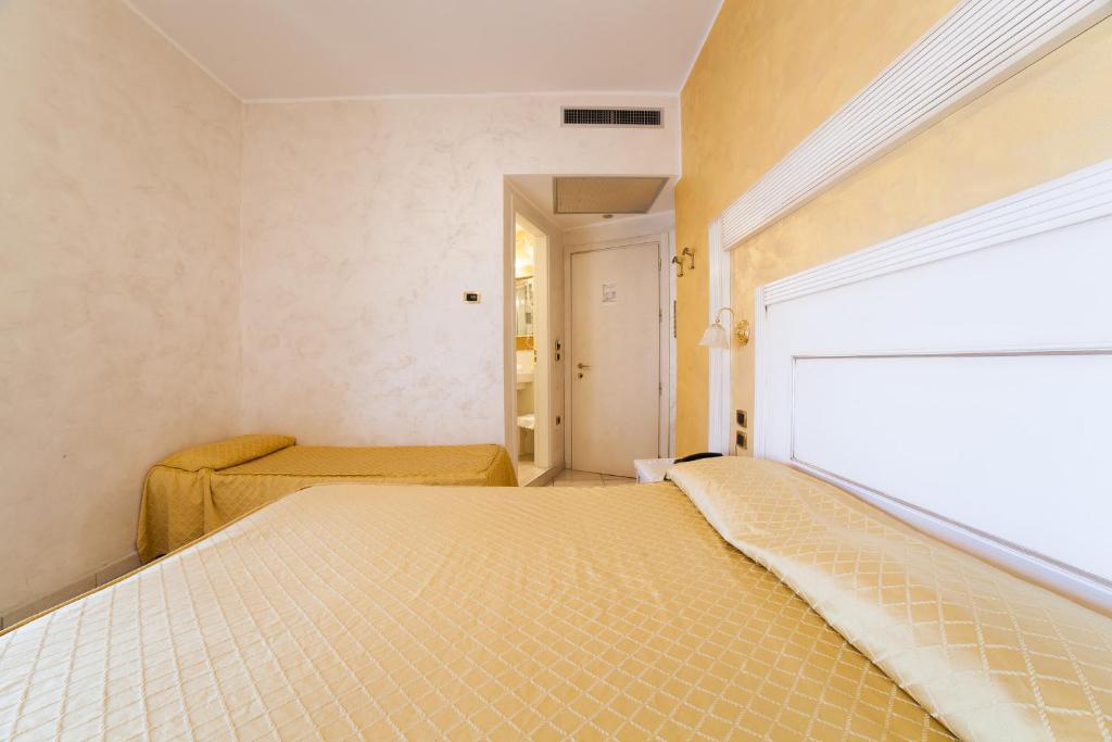 Cama ou camas em um quarto em Hotel Diplomat Palace