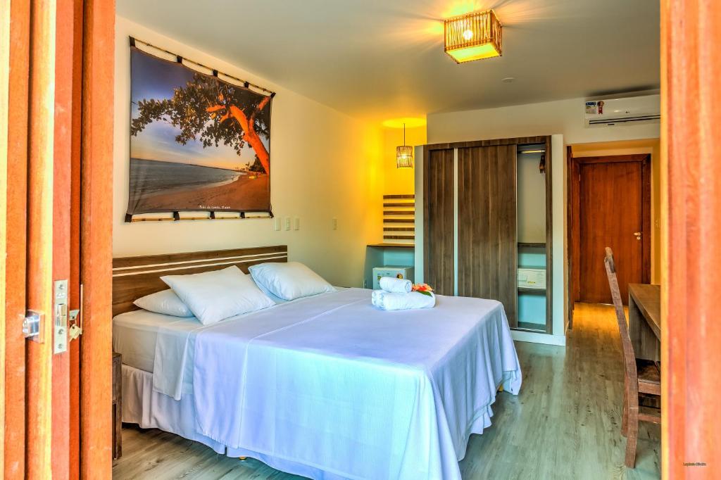 Cama ou camas em um quarto em Pousada Vila do Dengo