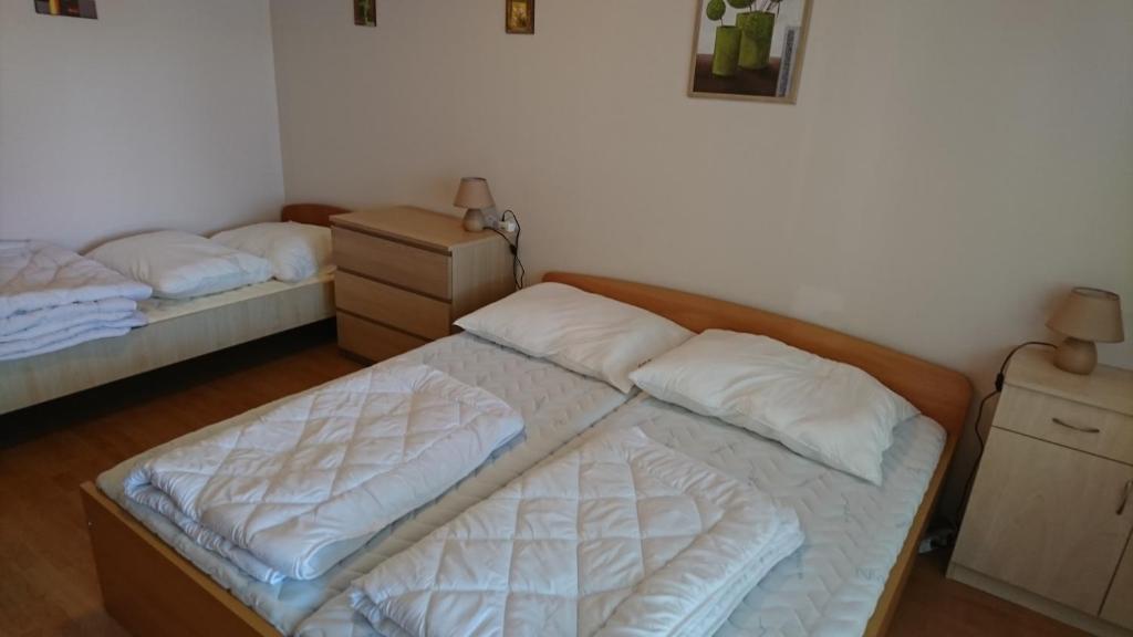 Posteľ alebo postele v izbe v ubytovaní Villa Palazzo Apartments