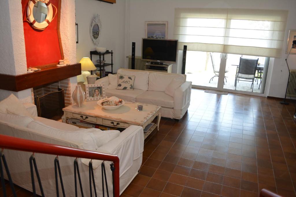 Telewizja i/lub zestaw kina domowego w obiekcie Private luxury villa My Beach House
