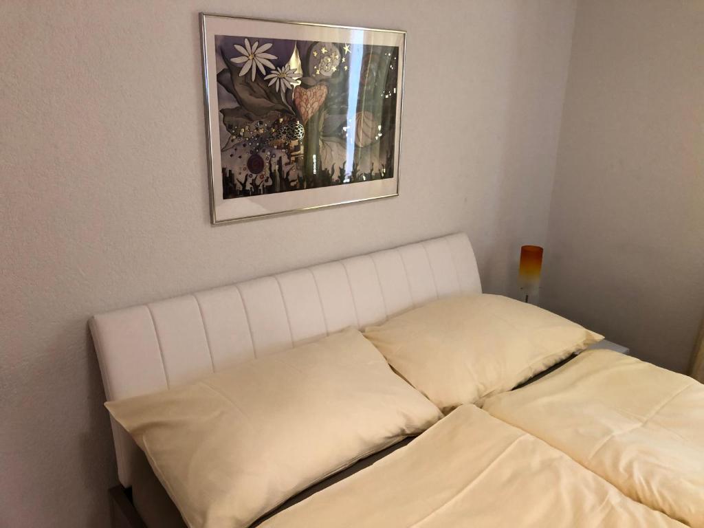 Una cama o camas en una habitación de SASS APARTHOTEL