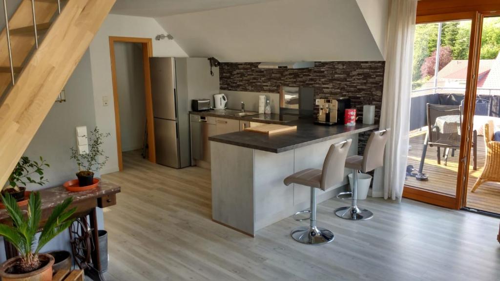 a kitchen with a counter and a counter top at Haus Rebblick in Offenburg