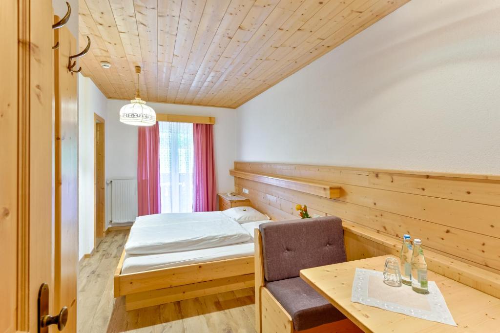 Postel nebo postele na pokoji v ubytování Garni Kircher Sepp