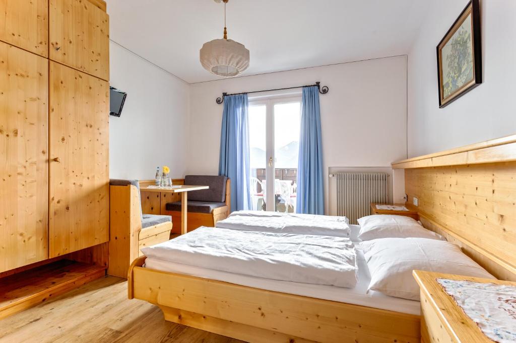 Postel nebo postele na pokoji v ubytování Garni Kircher Sepp