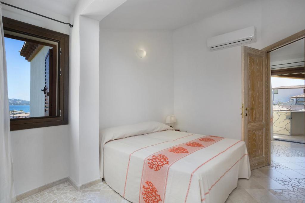 Postel nebo postele na pokoji v ubytování Le Maree Apartments
