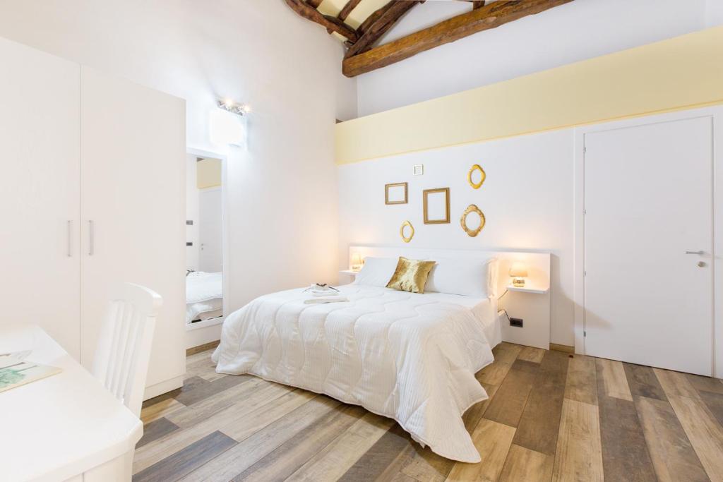 เตียงในห้องที่ Residenza le Scalette