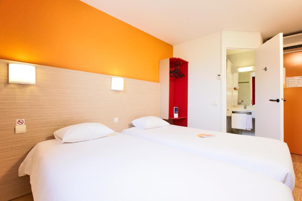 Cama o camas de una habitación en Première Classe Perpignan Nord - Aéroport