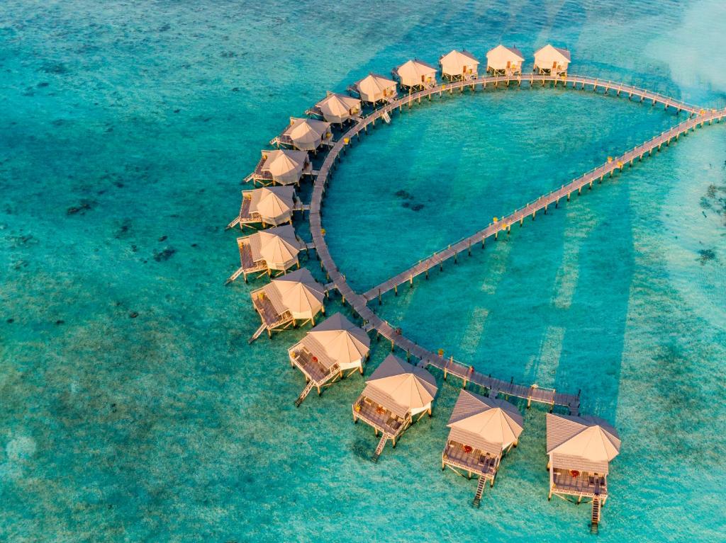 an aerial view of a resort island in the ocean at Komandoo Island Resort & Spa in Komandoo