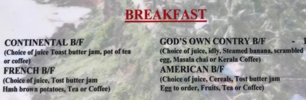 a menu for a restaurant with the words breakfast at Jickys Nest in Varkala