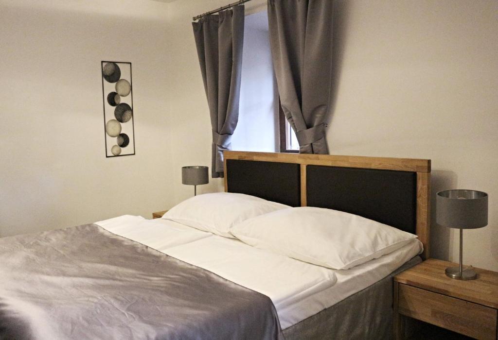 Postel nebo postele na pokoji v ubytování Český Statek