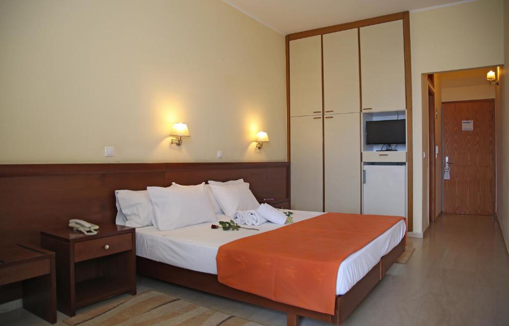 Postel nebo postele na pokoji v ubytování Elysee Hotel