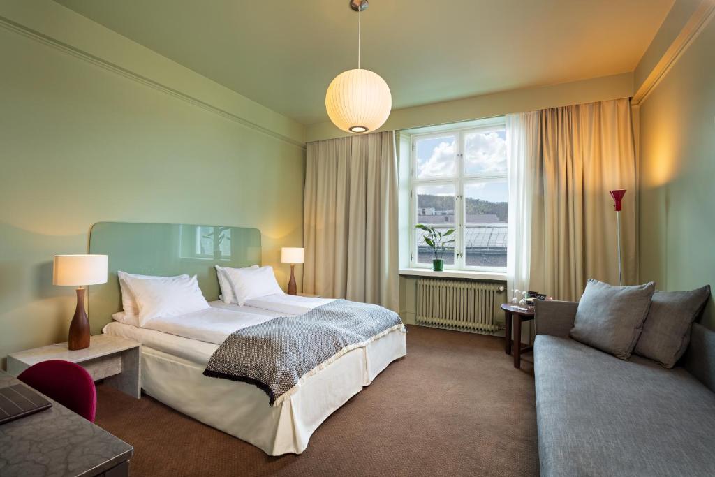 Postel nebo postele na pokoji v ubytování Grand Hotel Terminus