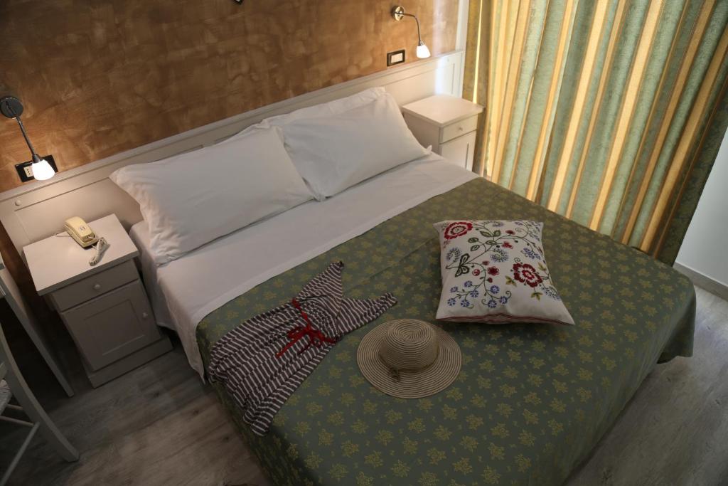 Postel nebo postele na pokoji v ubytování Hotel Ambrosiana