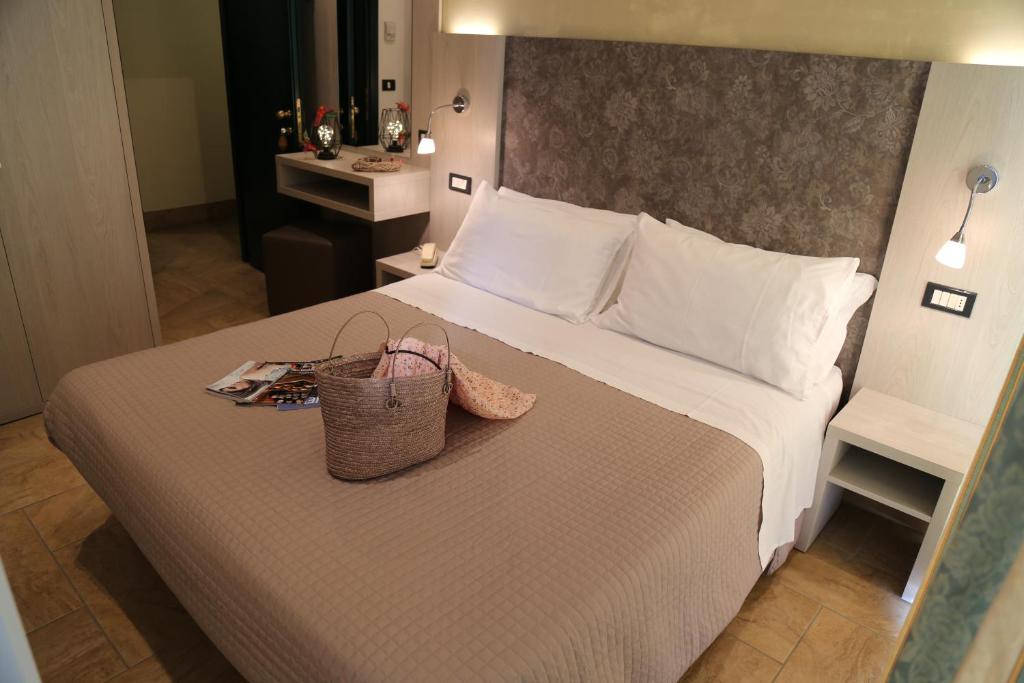 Postel nebo postele na pokoji v ubytování Hotel Ambrosiana