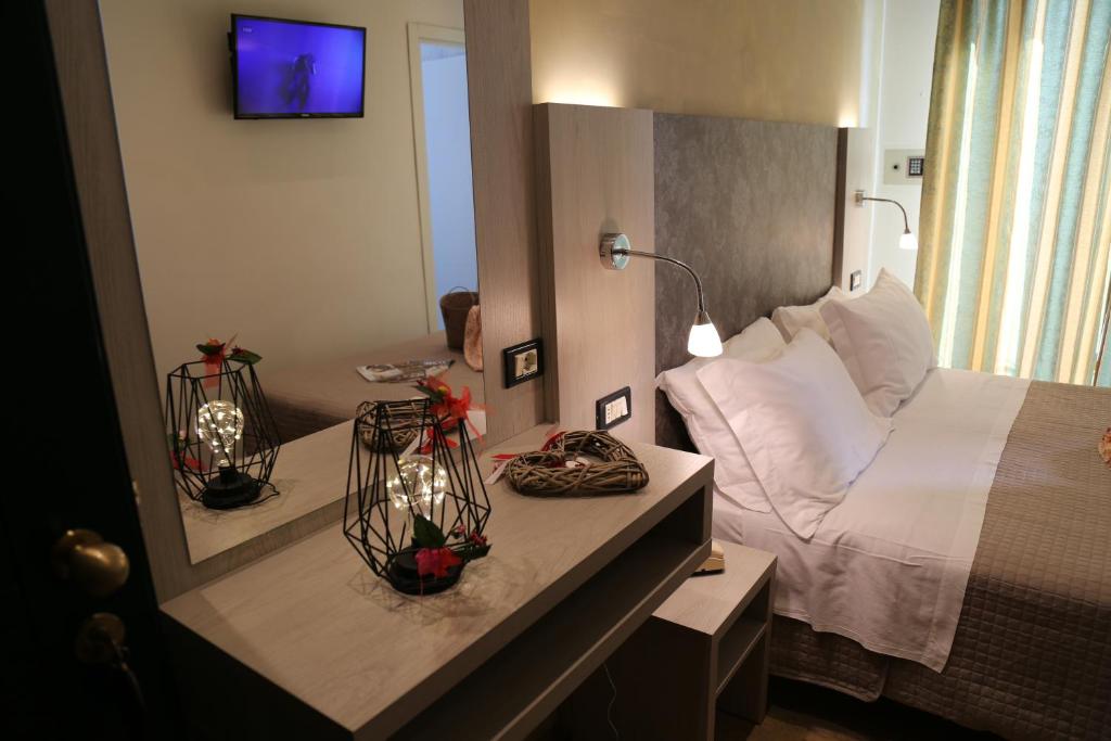 Postel nebo postele na pokoji v ubytování Hotel Ambrosiana