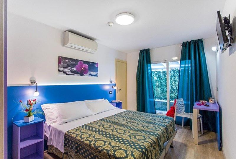 Postel nebo postele na pokoji v ubytování Hotel Ambrosiana