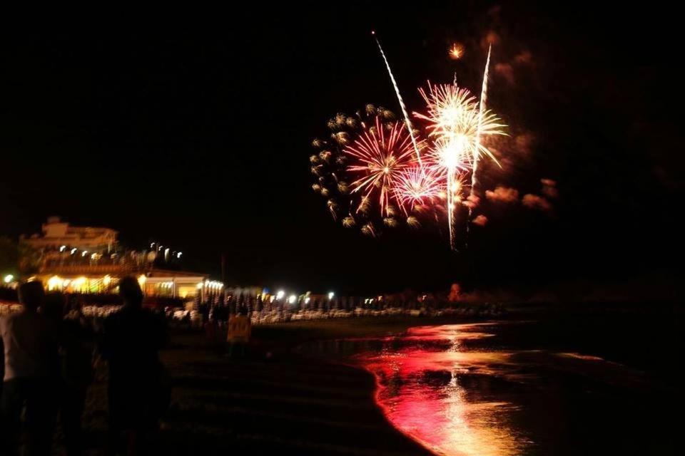 a firework display on the beach at night at CASA ELEGANTE in Martinsicuro