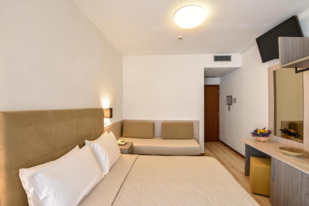 Postel nebo postele na pokoji v ubytování Hotel Excelsior