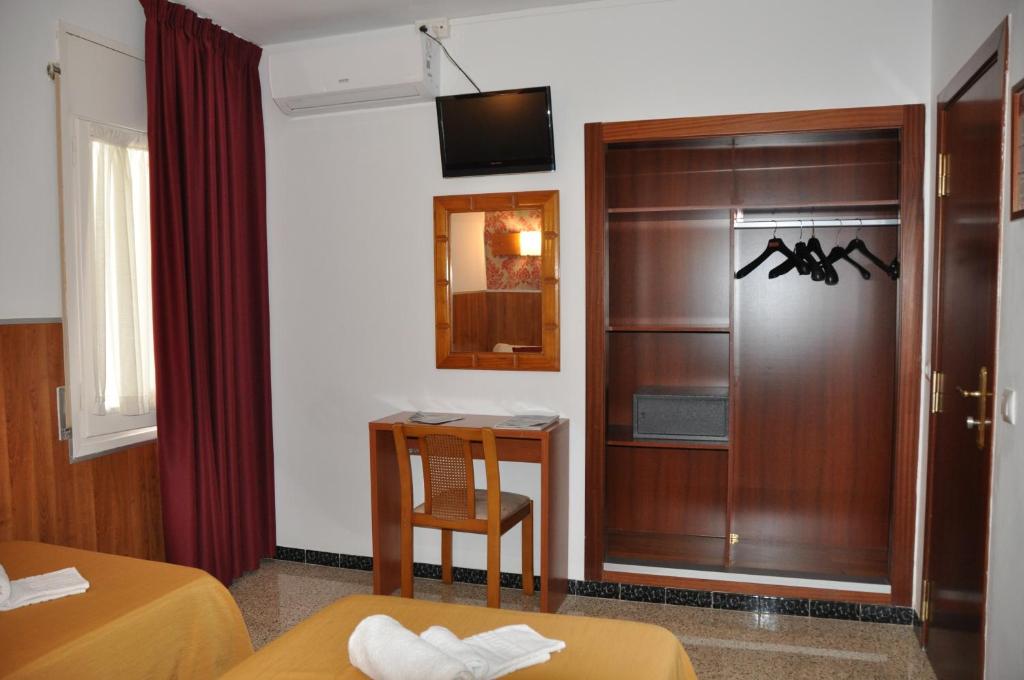 TV a/nebo společenská místnost v ubytování Hostal - Pensión El Amigo