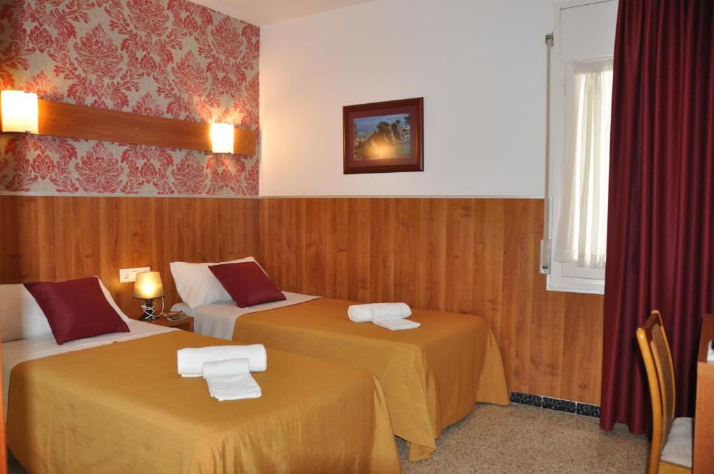 Postel nebo postele na pokoji v ubytování Hostal - Pensión El Amigo