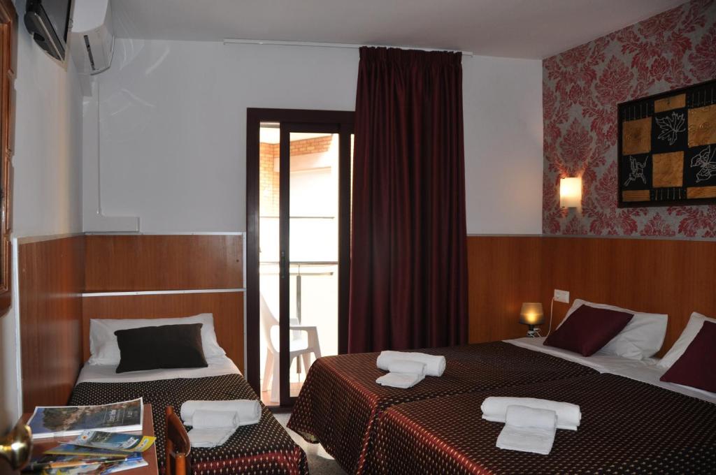Postel nebo postele na pokoji v ubytování Hostal - Pensión El Amigo