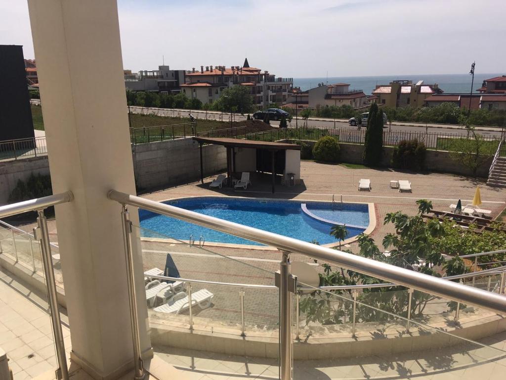 a view of a swimming pool from a balcony at Комплекс Ивет in Sveti Vlas