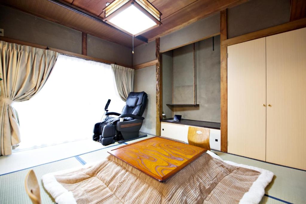 Postel nebo postele na pokoji v ubytování Gunma House
