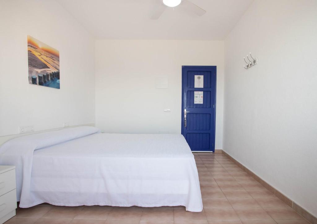 Postel nebo postele na pokoji v ubytování Hostal Mayans