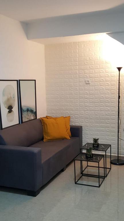 a living room with a couch and a table at "הפינה שלי בטבריה" in Tiberias