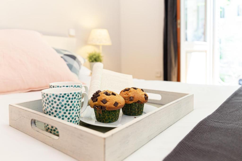 A bed or beds in a room at Apartamentos Plaza de España