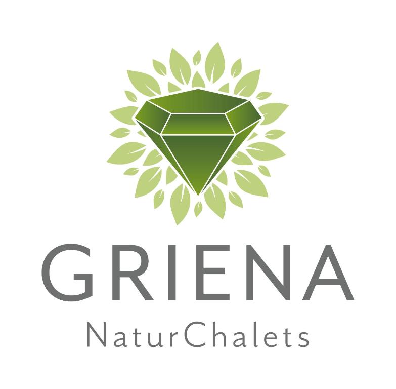 einem grünen Diamantlogo auf weißem Hintergrund in der Unterkunft Griena NaturChalets **** in Mayrhofen