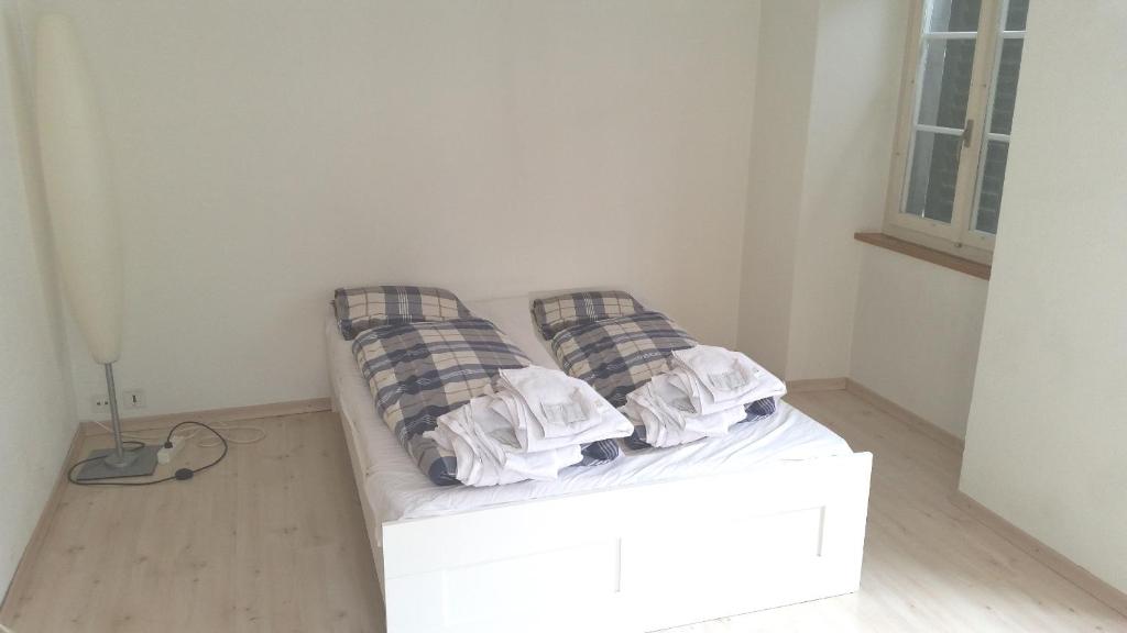 Postel nebo postele na pokoji v ubytování Tell Apartments Stans