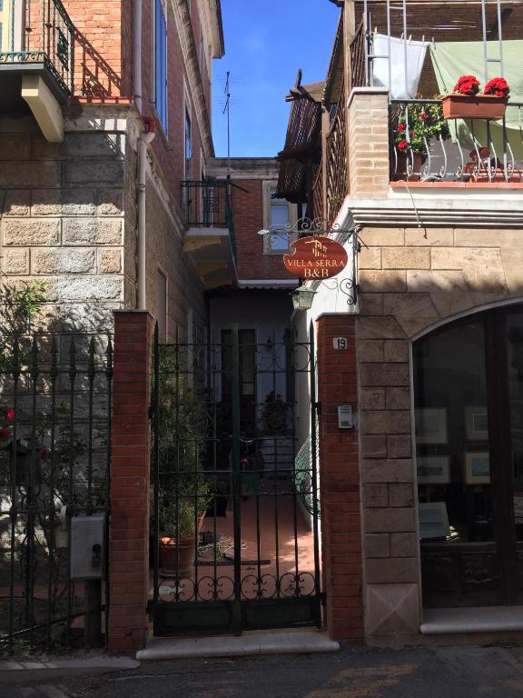 an entrance to a building with a wrought iron gate at Villa Serra B&B iun E6769 in Oristano
