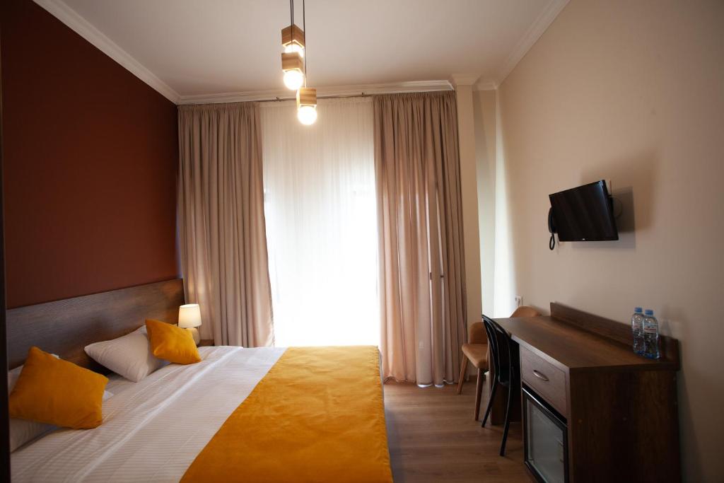Postel nebo postele na pokoji v ubytování Hotel Avenue 106