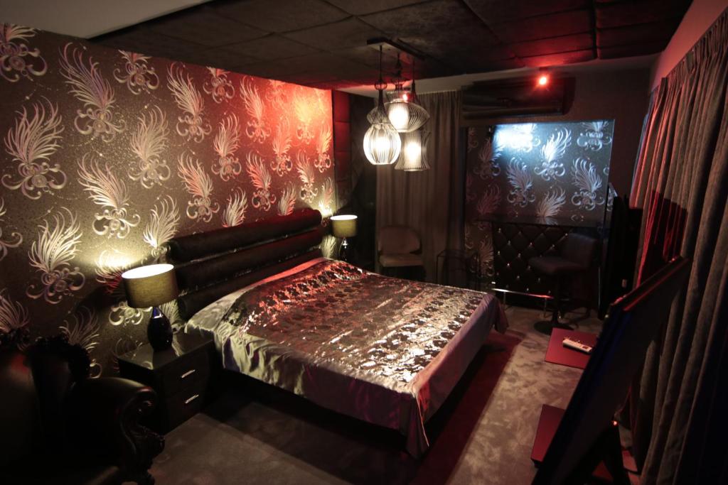 A bed or beds in a room at Madison