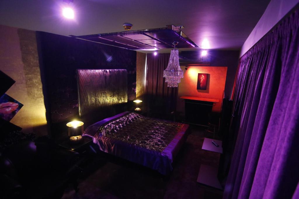 A bed or beds in a room at Madison