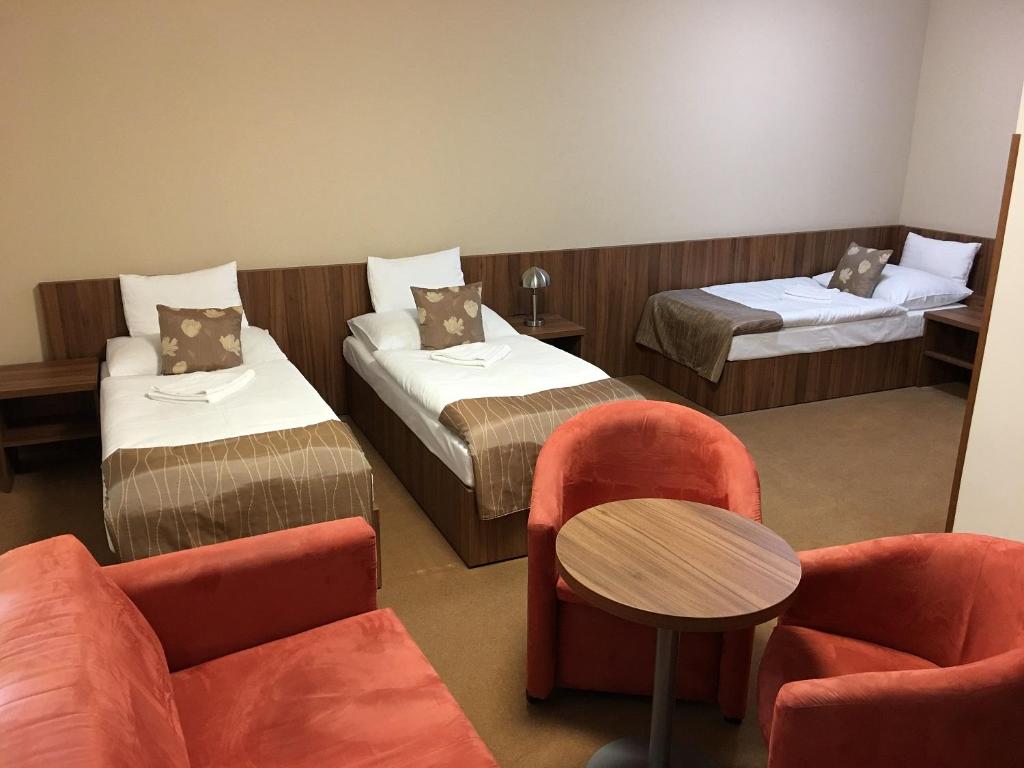 Postel nebo postele na pokoji v ubytování Hotel Ryšavý