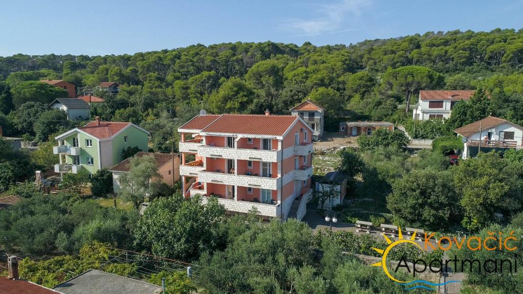 an aerial view of a building in a small town at Apartmani Kovačić in Kraj