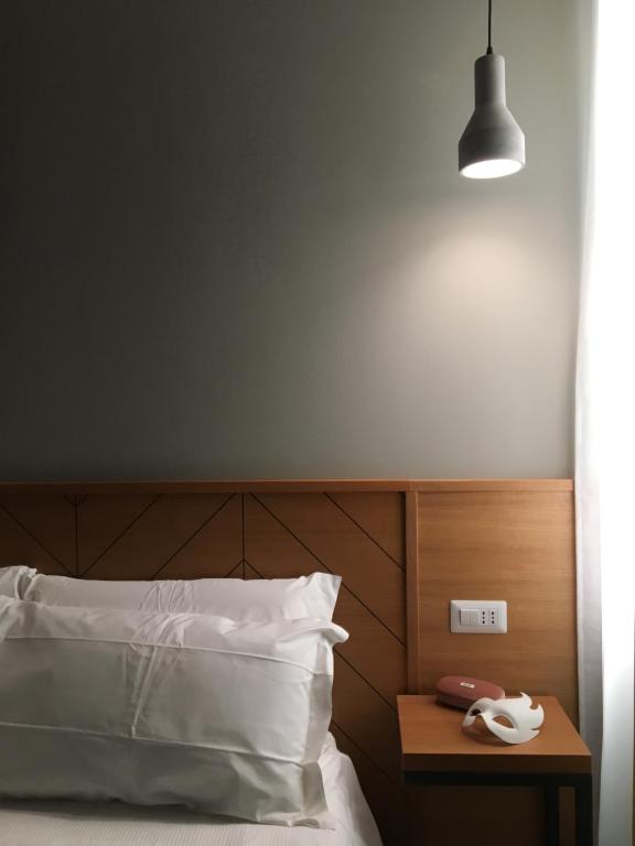 Postel nebo postele na pokoji v ubytování APARTHOTEL CASA MIA