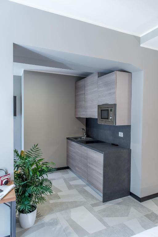 Kuchyň nebo kuchyňský kout v ubytování APARTHOTEL CASA MIA