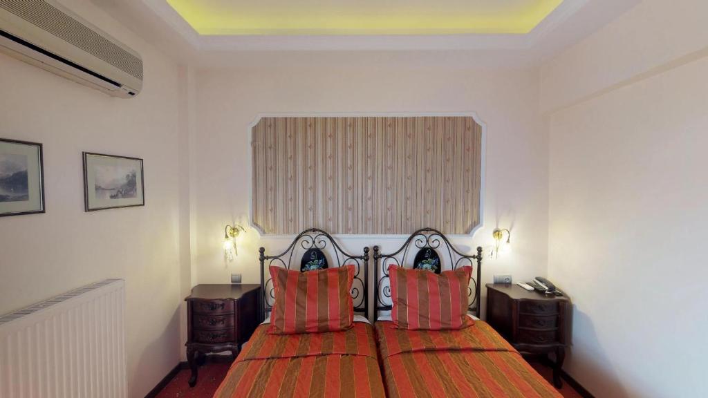 Postel nebo postele na pokoji v ubytování Hotel Mirto