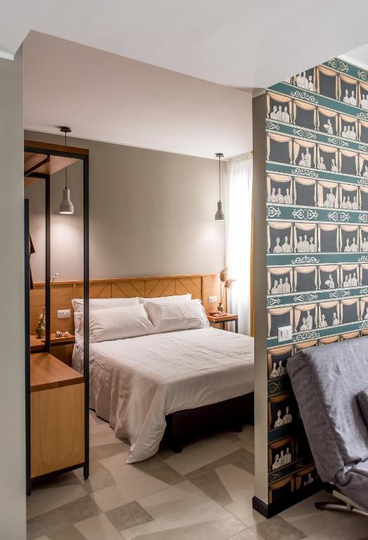Postel nebo postele na pokoji v ubytování APARTHOTEL CASA MIA