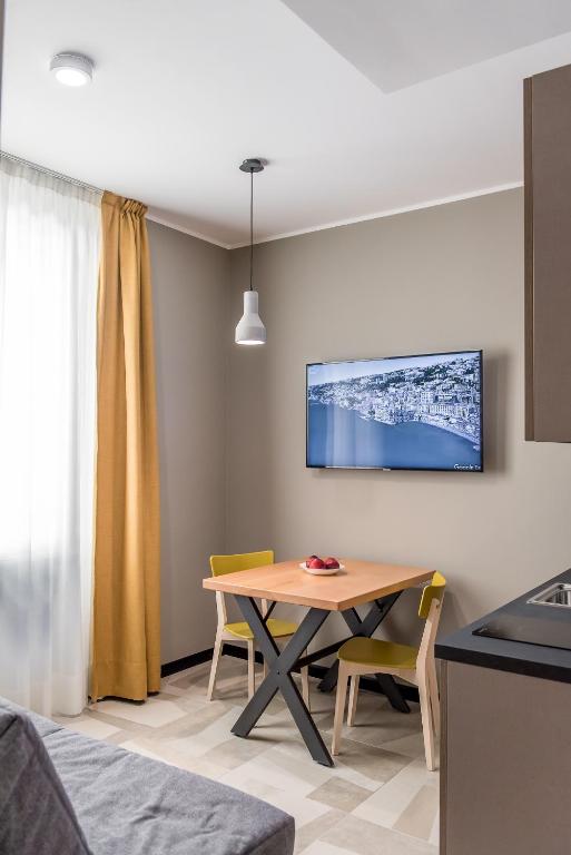 TV a/nebo společenská místnost v ubytování APARTHOTEL CASA MIA