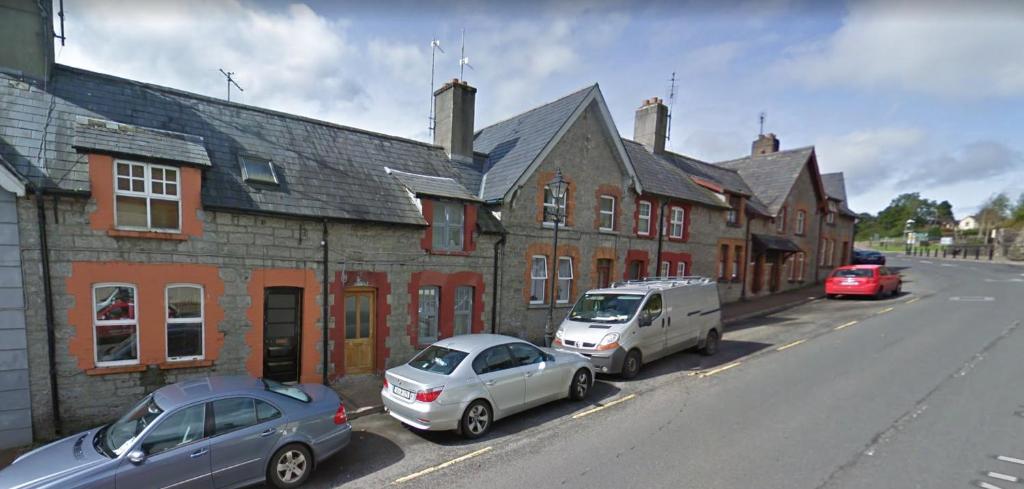 two cars parked on the side of a street at Lily's in Manorhamilton
