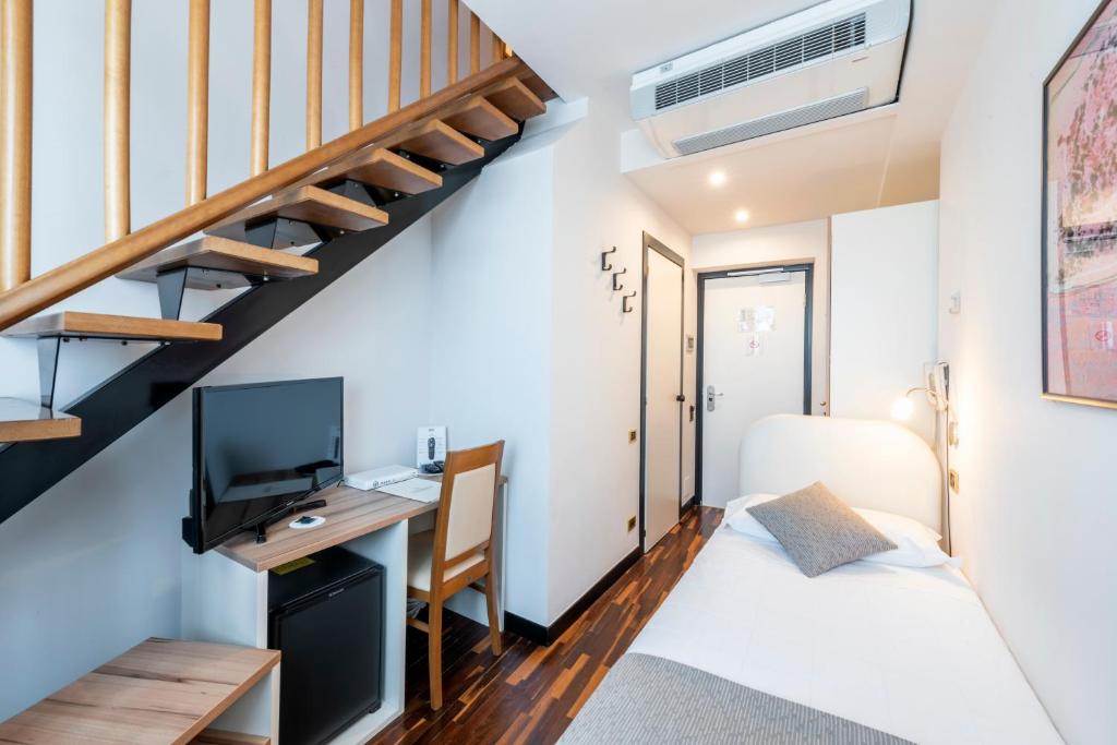 Postel nebo postele na pokoji v ubytování Hotel Asnigo