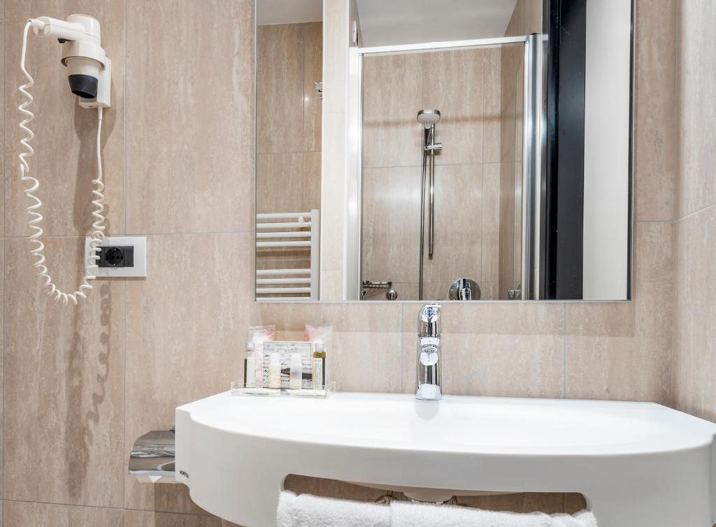 Koupelna v ubytování Hotel Asnigo